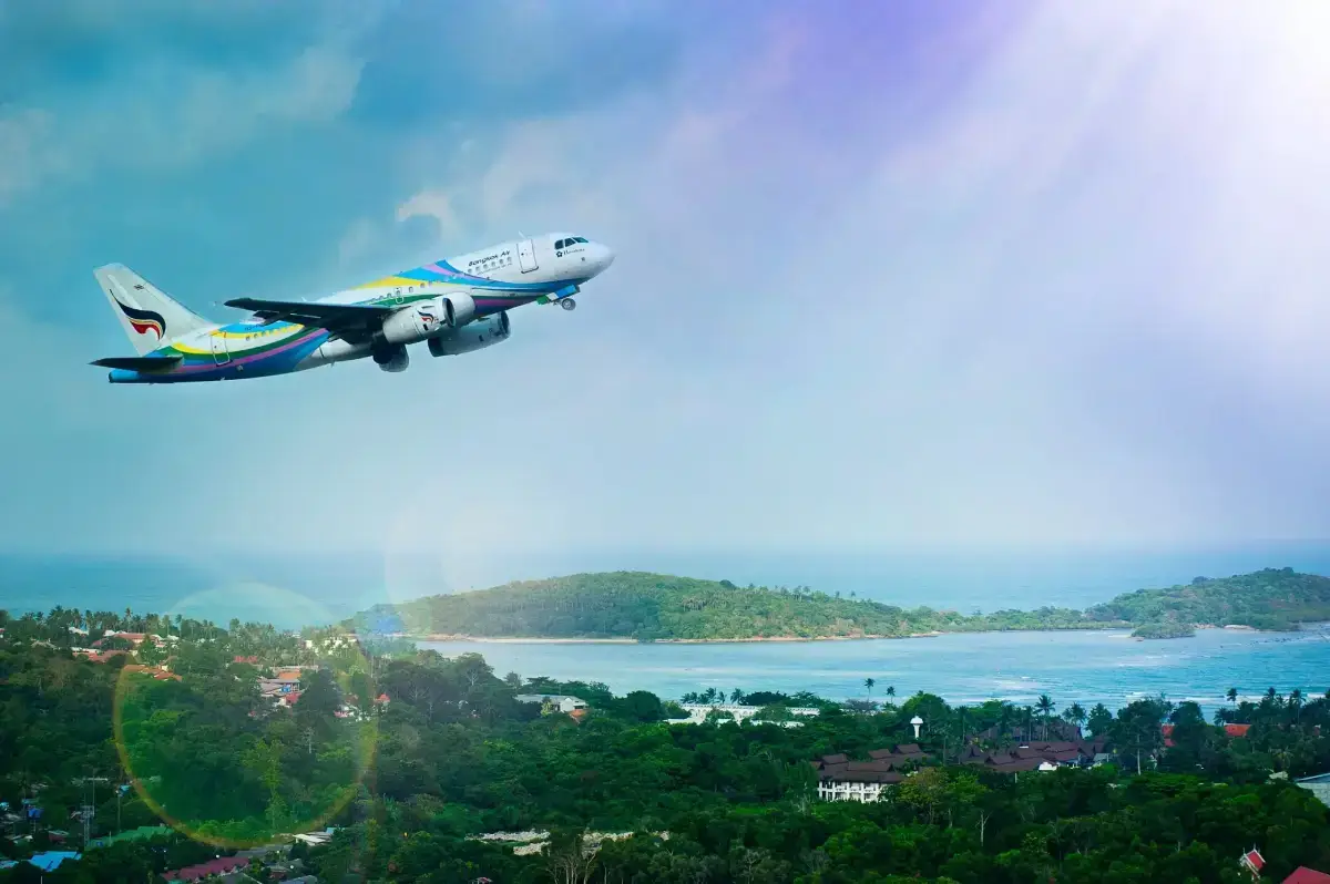Plane taking off from Thai island