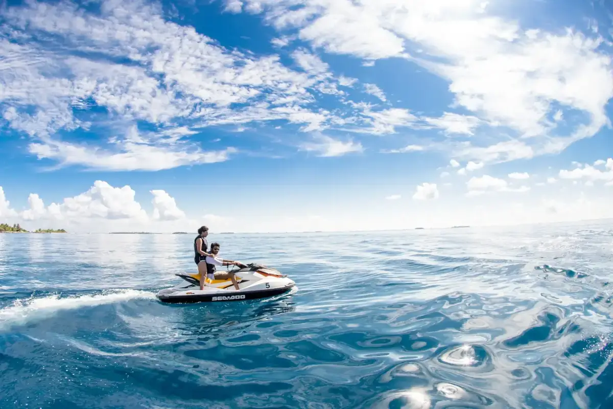 Two guys riding a jetski