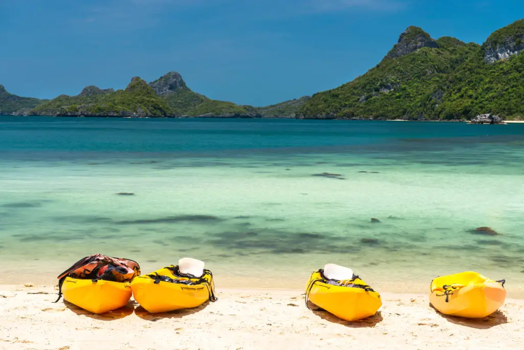 four banana boats on a beach