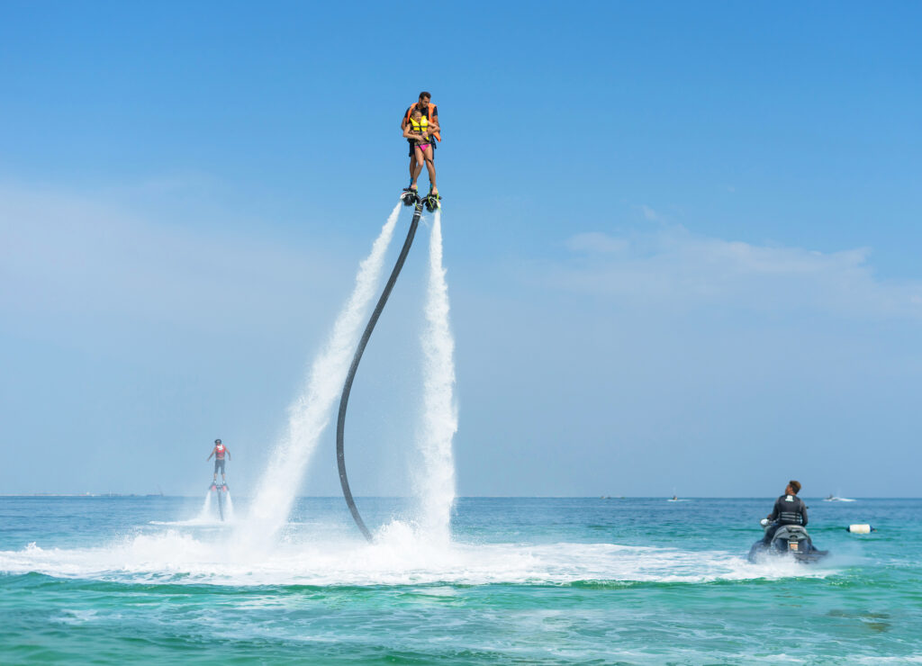 two people doing flyboarding
