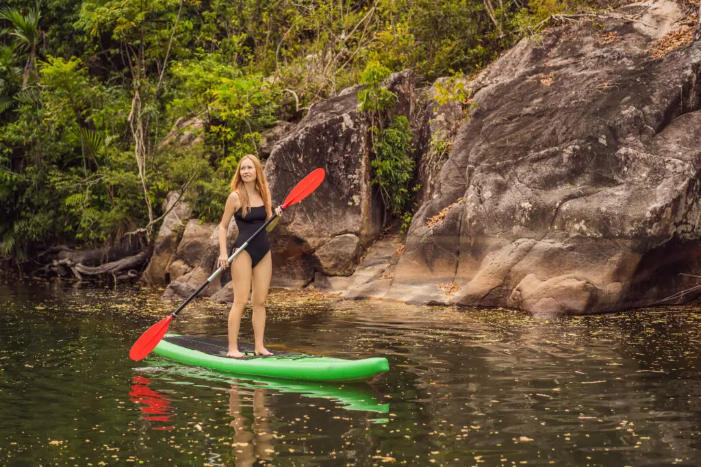 woman in a stand up paddle board